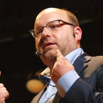 Gianluca Busato speaking at a public event